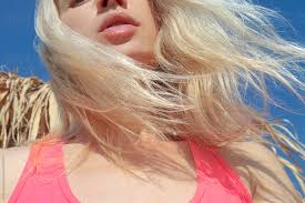 natural lips and blond hair in the wind