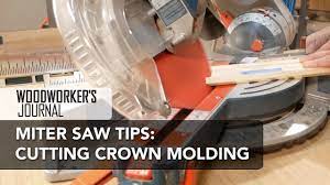 using a miter saw to cut crown molding