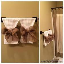 The first towel seems large and trendy with the design that gets backed by white and blue. Guest Bathroom Makeover Part 2 Bathroom Towel Decor Towel Decor Restroom Decor