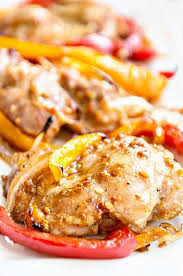 Season chicken thighs on all sides with garlic powder and onion flakes. Baked Boneless Chicken Thighs With Peppers And Onions Dine And Dish