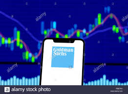 Goldman Sachs Logo Is Seen On An Smartphone Over Stock Chart