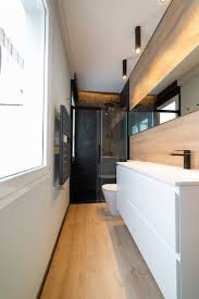 75 black tile light wood floor bathroom
