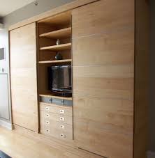 Your bed is the centrepiece of your bedroom, so why not choose a statement headboard? Modern Wall Unit Of Maple Wall Storage Cabinets Bedroom Wall Units Built In Wall Shelves