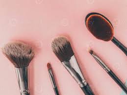 brushes on a pink background makeup