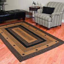black and tan braided rug with stars