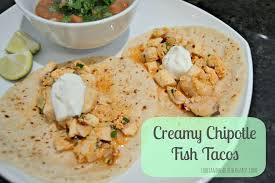 creamy chipotle fish tacos table and