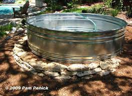 Concrete stock tank fountain rock added. How To Make A Container Pond In A Stock Tank Digging