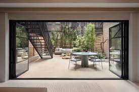 Brownstone Backyard With Folding Glass