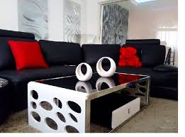 c shaped sofa with red throw pillows