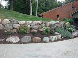 Boulders On A Sloped Driveway In