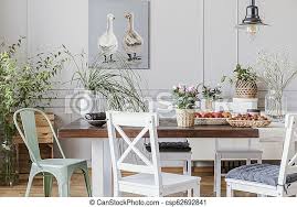 Our company is your number one source for rustic furniture, accessories, and leather sofas. Rustic Dining Room With Long Table And White Chairs And Oil Painting On The Grey Wall Real Photo Canstock