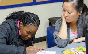 How to Help Your Kids With Homework   Parenting woman helping girl with homework