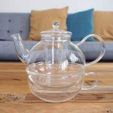 Glass Teapot With A Cup And Infuser