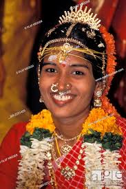 robed bride smiling tamil wedding