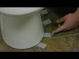 how to set a toilet on an uneven