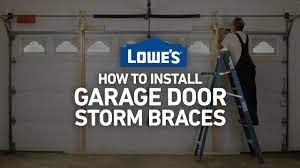 how to install garage door storm braces