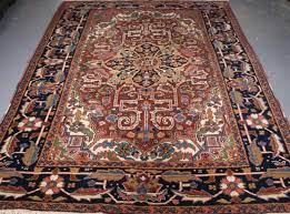 antique heriz carpet with a traditional