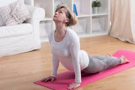older woman and yoga stock photo