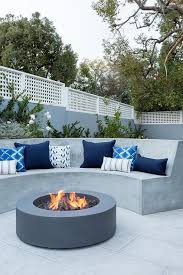 curved concrete outdoor sofa with round