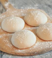 of neapolitan pizza dough dusted with flour