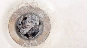 how to remove a shower drain cover