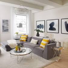 Gabrielle is the founder of décor site, savvy home, and has been a writer and editor for home décor and lifestyle publications for almost 10 years. Art Collections Yellow Decor Living Room Grey And Yellow Living Room Cozy Living Room Design
