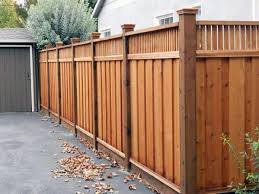 An uninterrupted line of boards stretches as far as the fence line runs with supporting posts. Top 70 Best Wooden Fence Ideas Exterior Backyard Designs