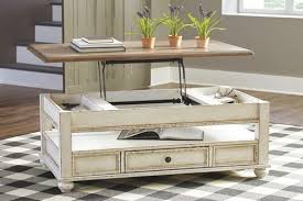 Standard furniture is a local furniture store, serving the birmingham, huntsville, hoover, decatur, alabaster, bessemer, al area. The Wystfield White Brown Cocktail Table With Storage Available At 5 Star Furniture Serving Dallas Tx And Garland Tx