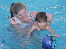swimming lesson for an autistic child