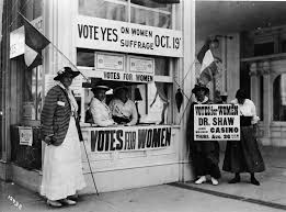 photograph of women suffargists standing by a voting stand this photograph of women suffargists standing by a voting stand this voting stand was to tell people to vote for women s suffarage and the women were holding