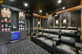 carpeted home theater with black walls