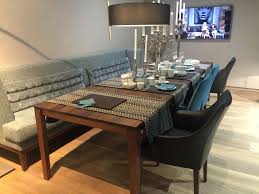 This modern upholstered dining bench is also available with arms. Versatile Dining Table Configurations With Bench Seating