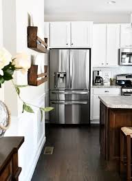white cabinets dark kitchen island for