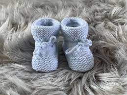 light blue knitted baby booties by