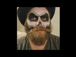 skull paint on a bearded man you