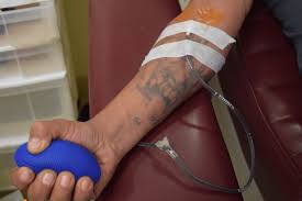 donate blood after getting a tattoo