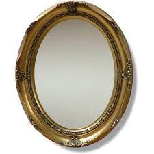 ornate gold oval framed wall mirror
