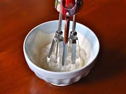 mixing by hand whipped cream topping