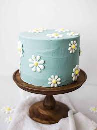 a happy daisy cake and a royal icing