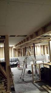 run ceiling drywall parallel or