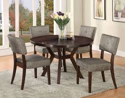 In smaller homes, use a small modern dining table as a kitchen table instead. Drake Contemporary Round Dining Table