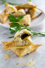 Chicken phyllo turnovers recipe this appetizer is based on bisteeya, a traditional moroccan pastry that pairs savory, spiced meat and flaky phyllo with a dusting of cinnamon and powdered sugar. Crispy Mushroom Filo Triangles Scrummy Lane