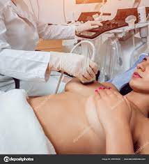 Gynecologist Performing Breast Examination Her Patient Using Ultrasound  Scanner Sonography Stock Photo by ©Romaset 249189230