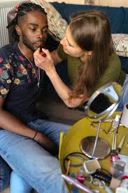 guy having a makeup makeover by