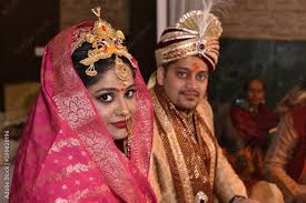 indian wedding couple posing for