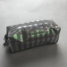 secret glittery striped makeup bag