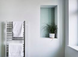 A Recessed Shelf Lined With Penny Tiles