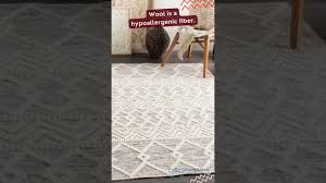 wool vs synthetic carpet which is