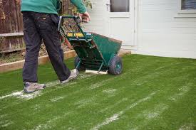 The stages of artificial grass installation. Why You Need Silica Sand To Install Your Fake Turf