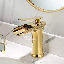 white brass single hole bathroom sink